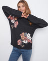 Sweater with a mock neckline and vibrant floral pattern, exuding elegance by Charlie B.