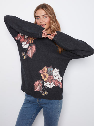 Sweater with a mock neckline and vibrant floral pattern, exuding elegance by Charlie B.