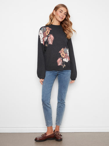 Chic drop shoulder design sweater featuring colorful florals for a stylish look by Charlie B.