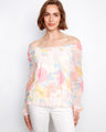 Elegant top with off-the-shoulder neckline and a delicate floral design, perfect for a stylish look by Charlie B.