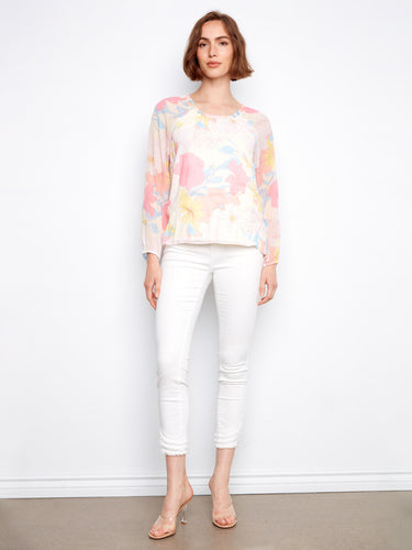 Floral top showcasing an intricate pattern that brings vibrant colors to your wardrobe by Charlie B.