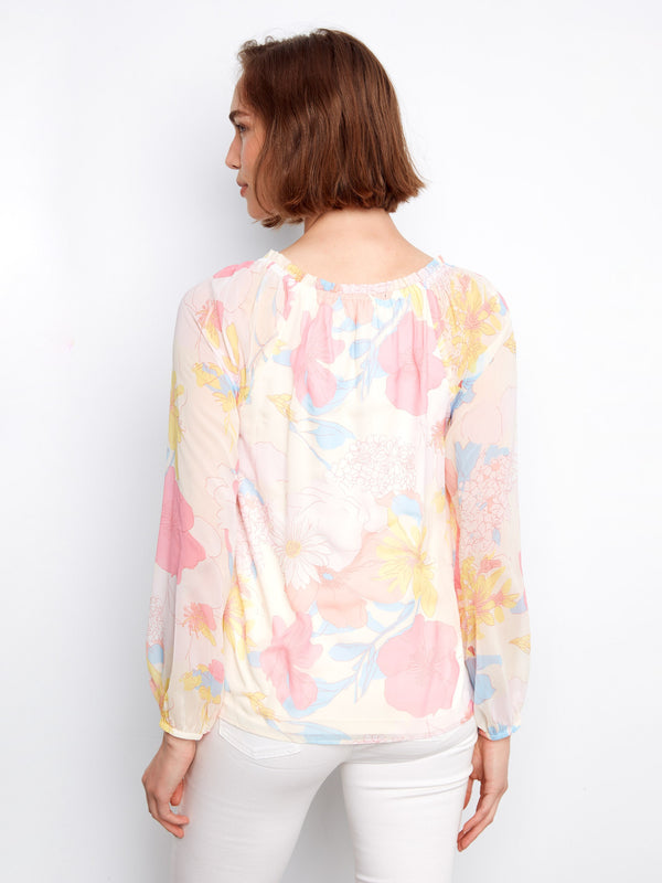 Beautiful floral design on this chic blouse adds a fresh and lively element to your style by Charlie B.