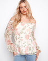Floral blouse with an off-the-shoulder neckline and charming balloon sleeves, perfect for a breezy look by Charlie B.