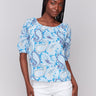 Blue blouse with a round neckline and paisley print, crafted from 100% cotton by Charlie B.
