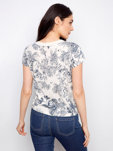 Chic short-sleeve top showcasing a blue floral design on organic cotton fabric with drop shoulders by Charlie B.