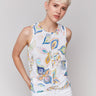 White tank top featuring a crew neckline and feather print by Charlie B.