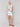 Sleeveless white tank with a front knot detail by Charlie B.