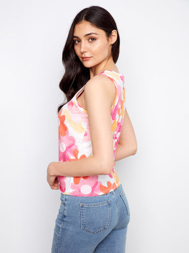 Floral patterned tank top in vivid colors featuring an eye-catching twisted hem at the front by Charlie B.