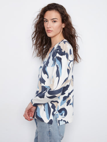 The unique drop shoulder design gives this sweater an effortlessly stylish appeal, perfect for any occasion by Charlie B.
