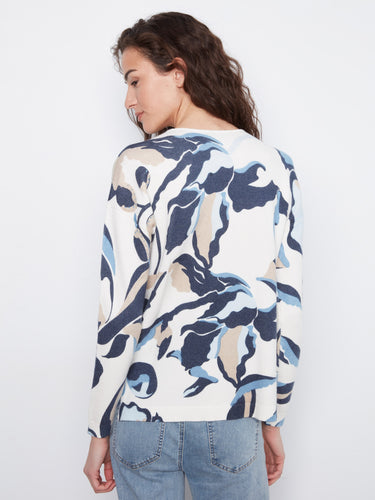 Side slits add a modern twist to this patterned sweater, providing comfort and style in one piece by Charlie B.