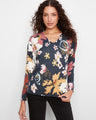 This floral sweater features a stylish V-neck, perfect for any casual outing. Designed by Charlie B.