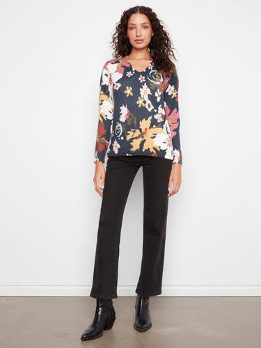 A charming blend of colors and patterns defines this soft knit floral sweater. Fashioned by Charlie B.