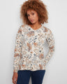 Floral print sweater with a V-neck and side slits, offering a stylish and comfortable look by Charlie B.