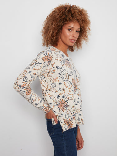 Drop shoulder design enhances the relaxed fit of this floral printed V-neck sweater by Charlie B.