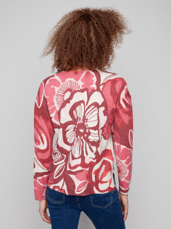 Charming floral pattern sweater with a soft plush feel, highlighted in rich reds and pinks by Charlie B.