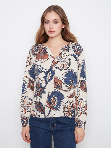 Floral blouse with a relaxed fit, featuring a vibrant print and elastic cuffs by Charlie B.