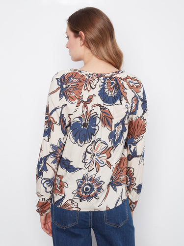 Blouse with raglan sleeves, showcasing a tapestry floral print and soft texture by Charlie B.