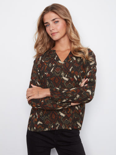 The raglan sleeves on this top provide comfort and style, perfect for any casual occasion. Crafted with care by Charlie B.