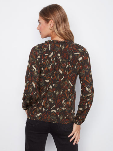 With its elegant cut and relaxed fit, this garment is ideal for those seeking both style and comfort in one piece by Charlie B.