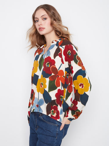 Vibrant floral shirt in soft viscose fabric, designed with a notch neckline and relaxed fit for style by Charlie B.