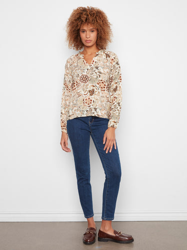 Elegant floral top featuring raglan sleeves, offering a unique and fashionable look. Made by Charlie B.