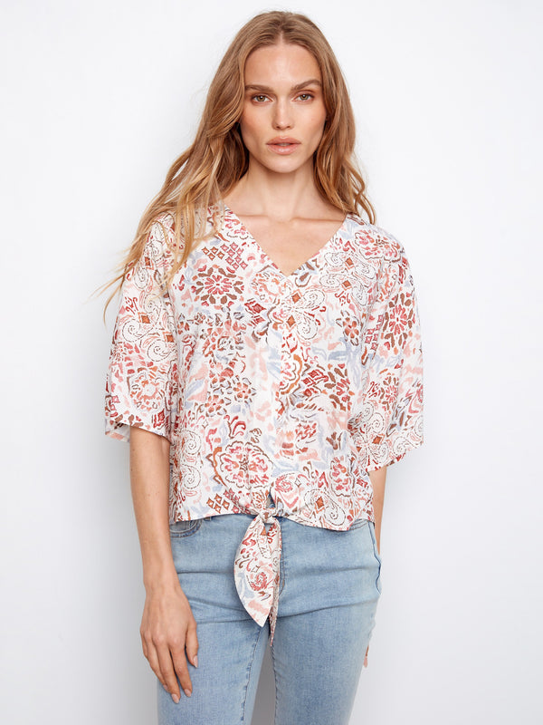 Stylish V-neck blouse with vibrant prints, ideal for adding a splash of color to your wardrobe by Charlie B.