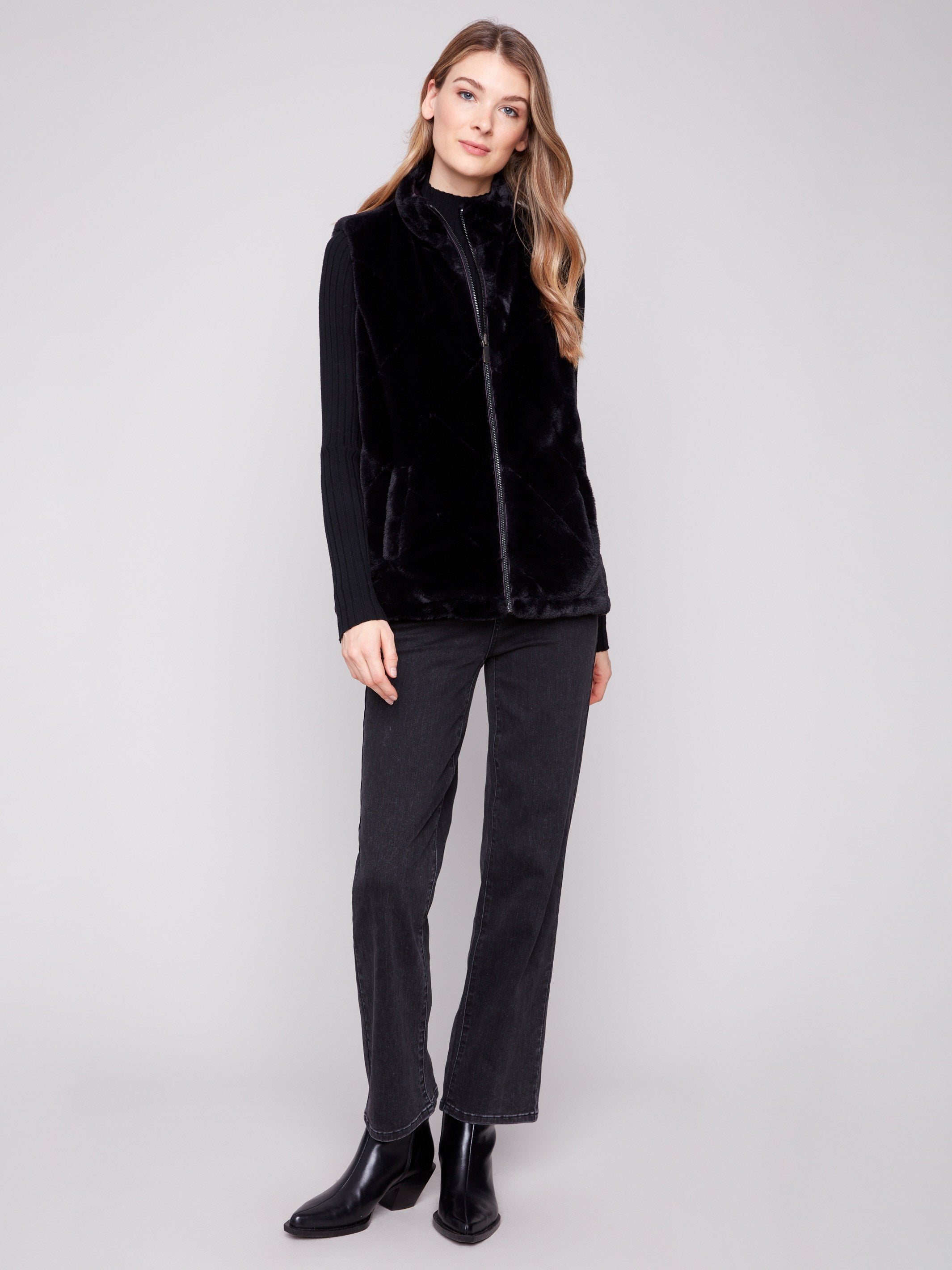 Soft faux fur vest offering cozy warmth and stylish welt pockets by Charlie B.