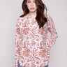 Calico sweater with a boat neck and abstract floral print, featuring ribbed sleeves for added texture by Charlie B.