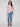 Sweater in calico design with side slits, showcasing an abstract floral pattern and rounded hem by Charlie B.