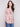 Calico sweater featuring a stylish boat neck and abstract floral design, complete with practical side pockets by Charlie B.