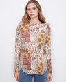 Patchwork top with a boat neckline and floral patterns, perfect for a casual look. By Charlie B.