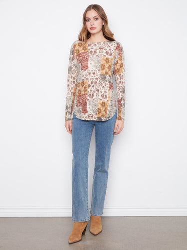 Stylish top featuring drop shoulders, adding comfort and elegance to any outfit. By Charlie B.