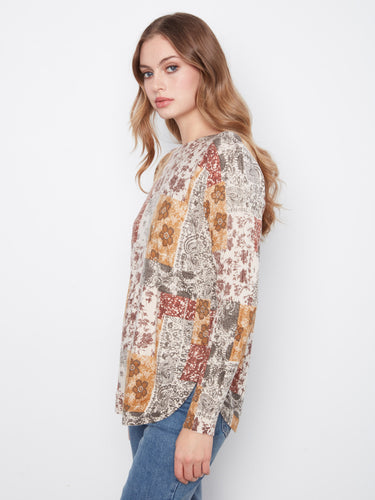 Floral patchwork design with a rounded hem, offering a chic and relaxed fit. By Charlie B.