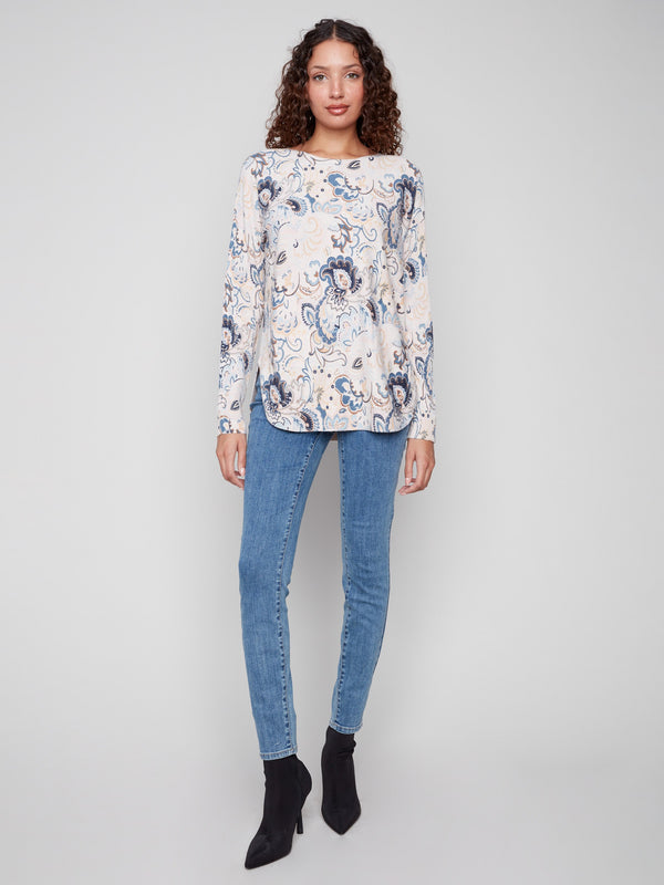 Floral blush sweater with ribbed sleeves, offering both style and comfort by Charlie B.