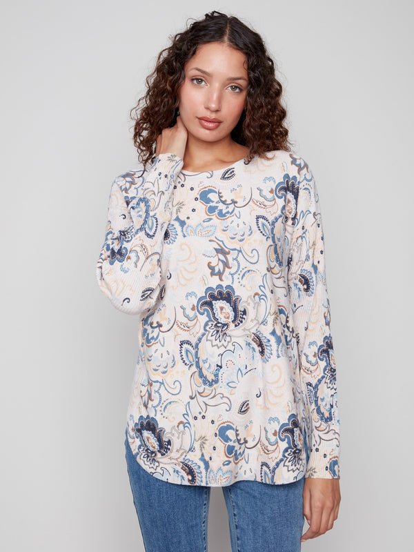 Elegant blush sweater with side slits and floral design for added flair by Charlie B.