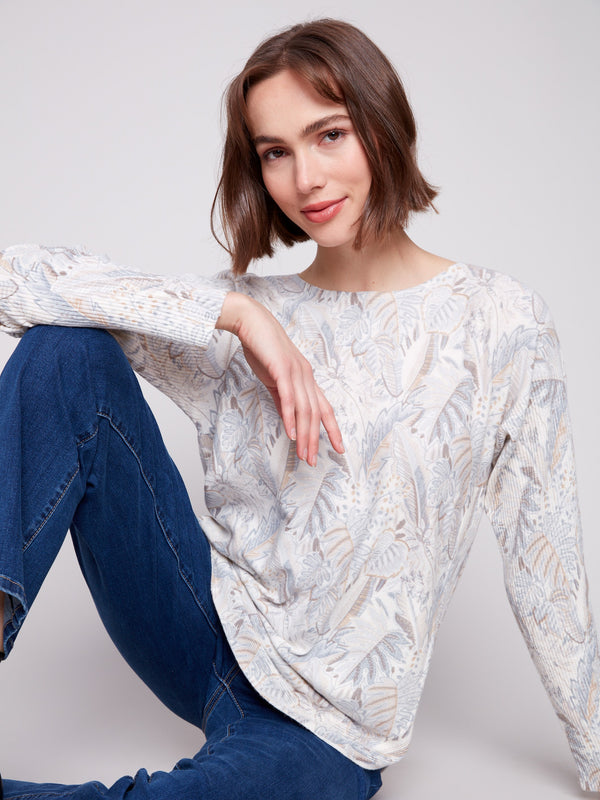 Stay cozy in the ribbed sleeves of this elegant foliage pattern sweater by Charlie B.
