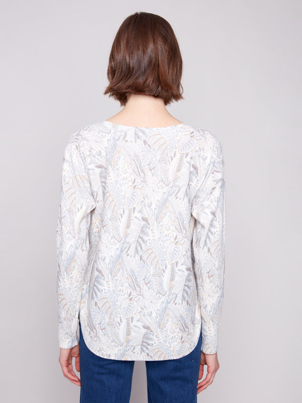 Featuring a rounded hem and delicate foliage design, this sweater adds elegance to your wardrobe by Charlie B.