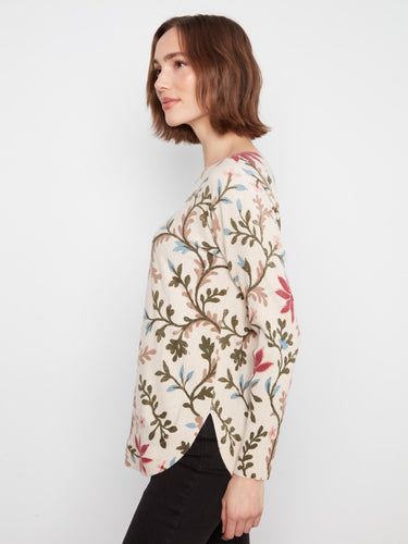 Floral print top featuring side pockets for convenience, paired with drop shoulders for added comfort. By Charlie B.
