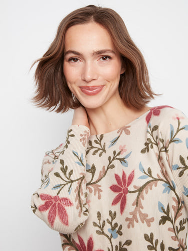 Top adorned with delicate florals and practical side pockets, ensuring both fashion and utility. Crafted by Charlie B.