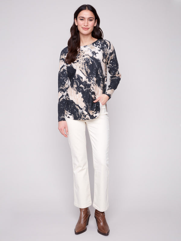 Granite sweater showcasing its elegant rounded hem and convenient side pockets, perfect for casual outings by Charlie B.