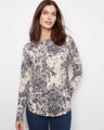 The top features a boat neckline, offering a classic and elegant touch to the overall design by Charlie B.