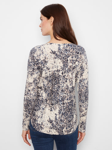 The top includes side pockets for added convenience and practicality in everyday wear by Charlie B.