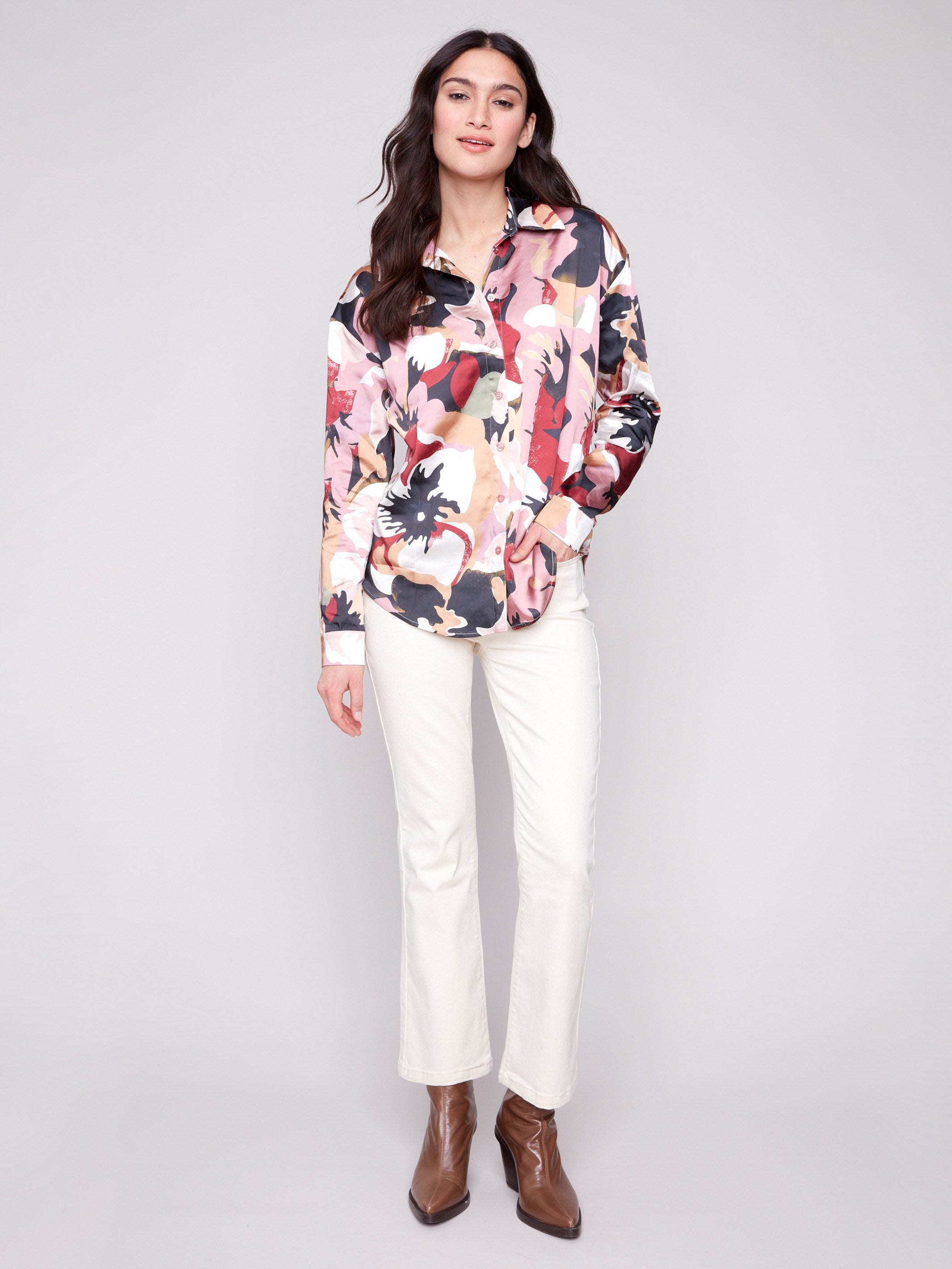 Stylish button-down satin shirt featuring a colorful pattern and long cuffed sleeves by Charlie B.