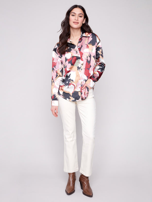 Stylish button-down satin shirt featuring a colorful pattern and long cuffed sleeves by Charlie B.