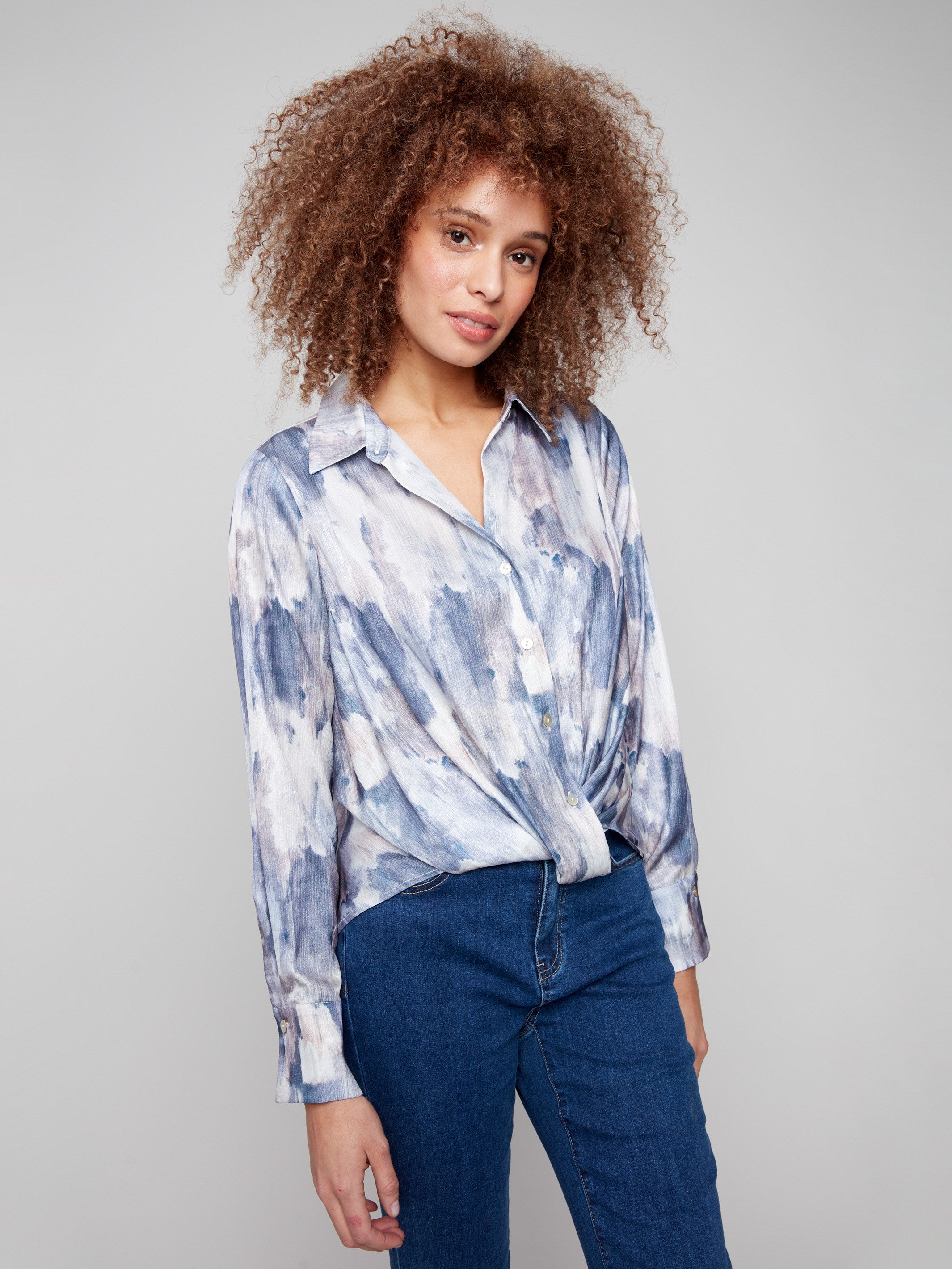 Shirt with a textured satin finish and elegant shirt collar, showcasing an abstract print pattern by Charlie B.