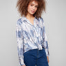 Shirt with a textured satin finish and elegant shirt collar, showcasing an abstract print pattern by Charlie B.