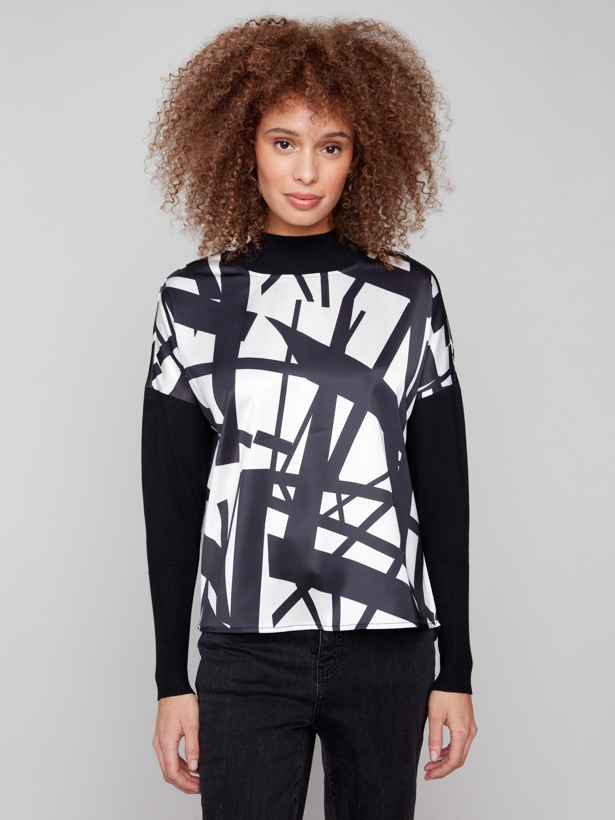 Black and cream abstract patterned top featuring ribbed sleeves and neckline for added texture by Charlie B.