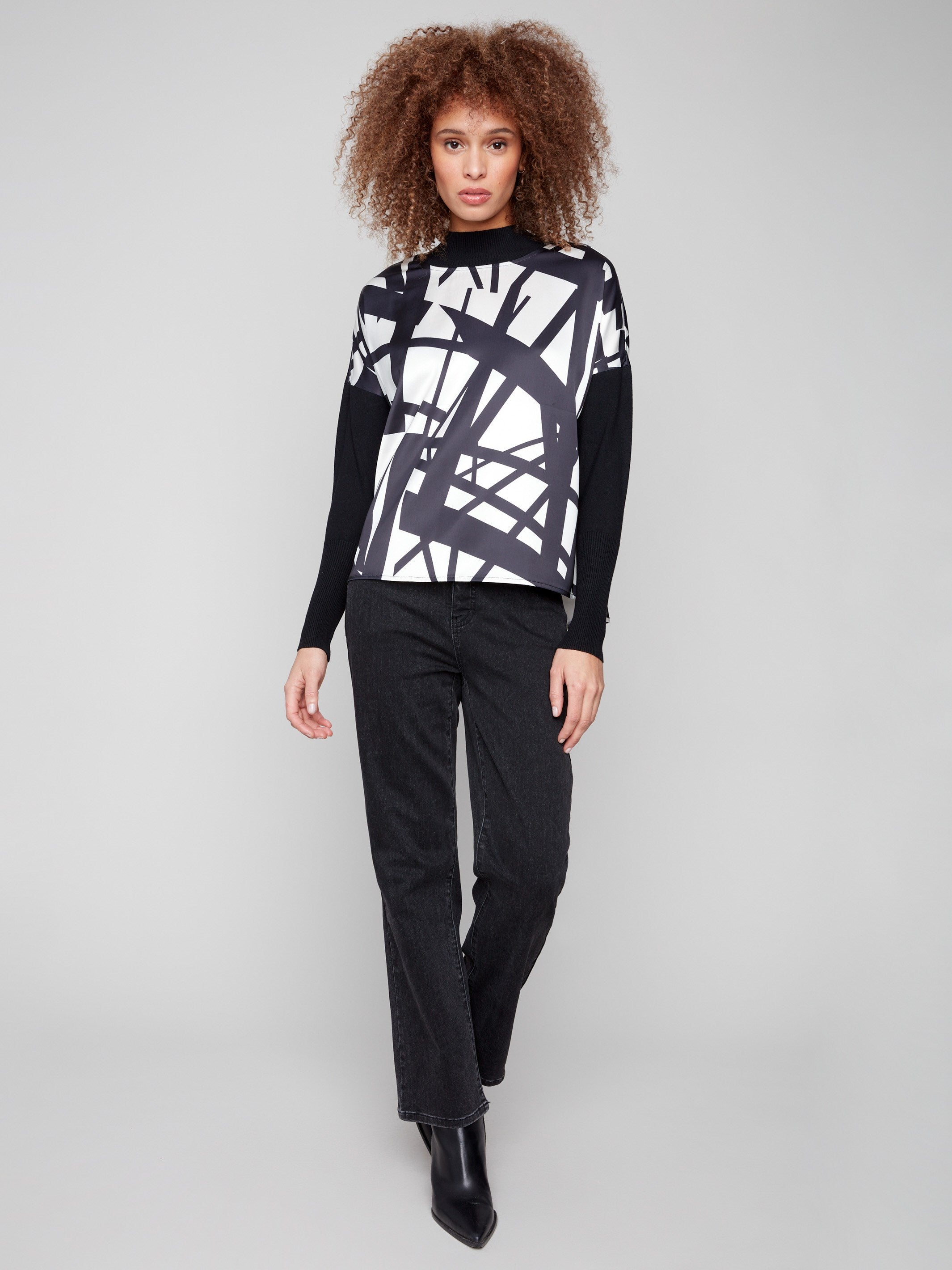 Abstract patterned top in black and cream with a front seam detail for a refined touch by Charlie B.