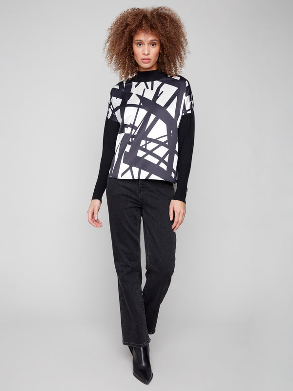 Abstract patterned top in black and cream with a front seam detail for a refined touch by Charlie B.