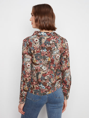 Long sleeves enhance the elegance and versatility of this beautifully patterned floral blouse by Charlie B.